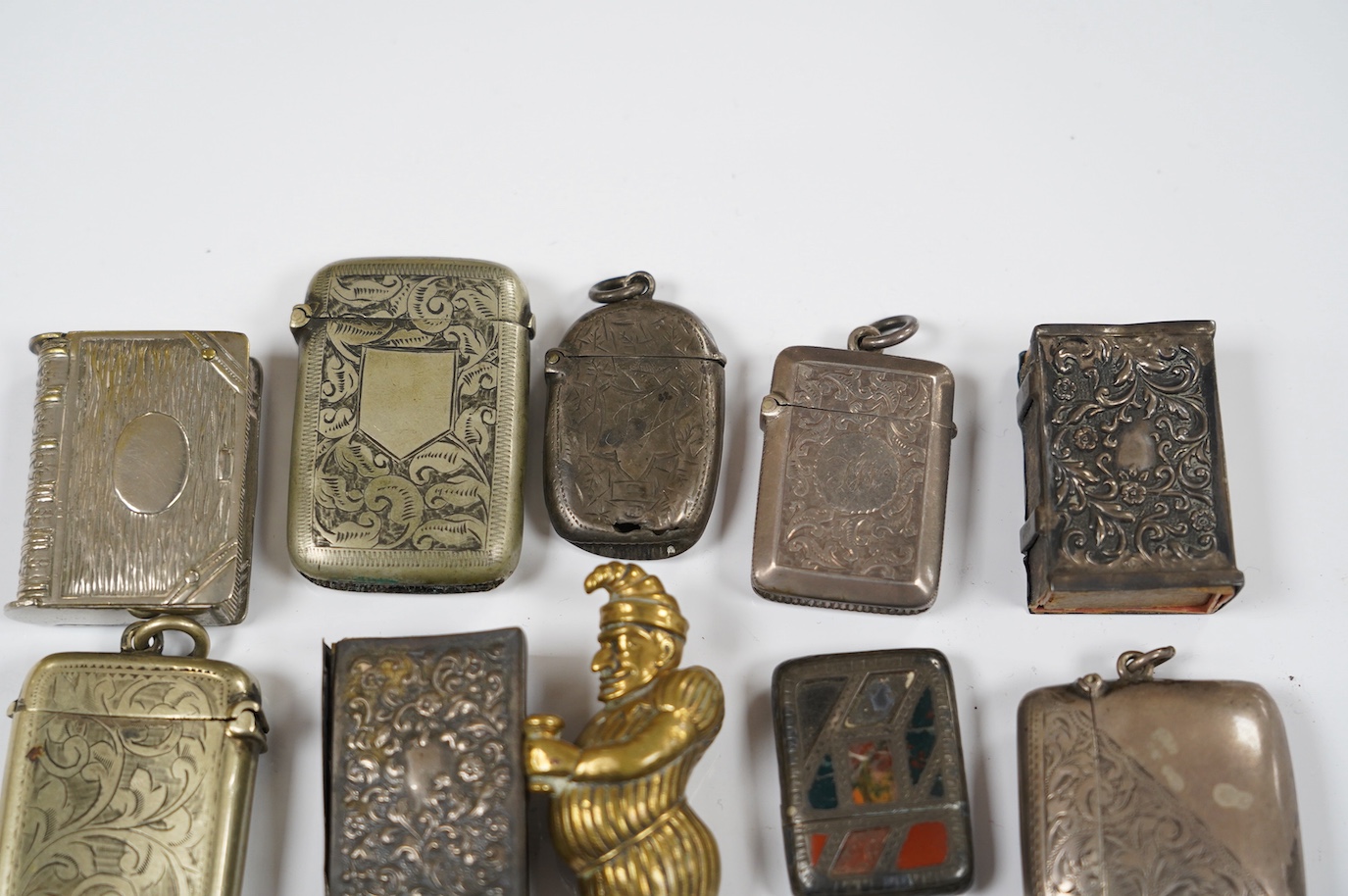 Thirteen silver and novelty vesta cases. Condition - fair